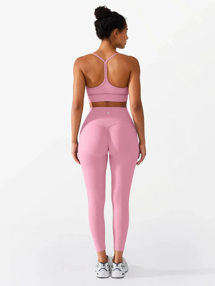 A model wearing a BRXL® Flow Y Racerback Bra with Low Cut and Spaghetti Straps in