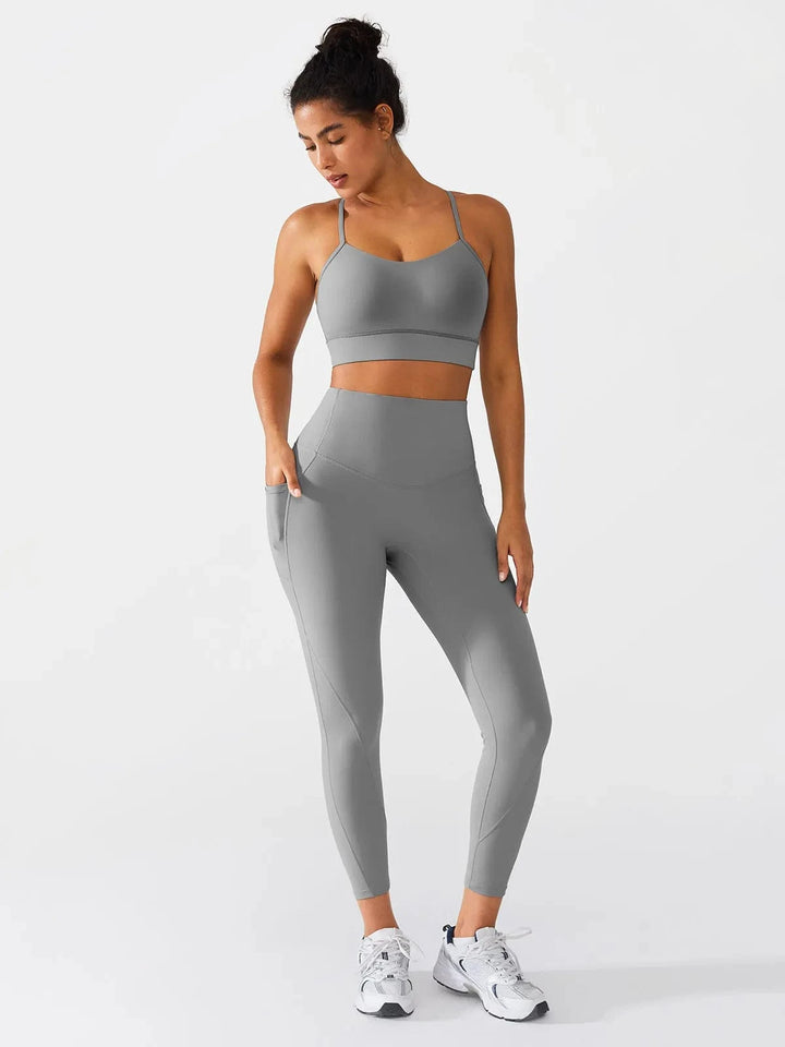 A model wearing a BRXL® Flow Y Racerback Bra with Low Cut and Spaghetti Straps in