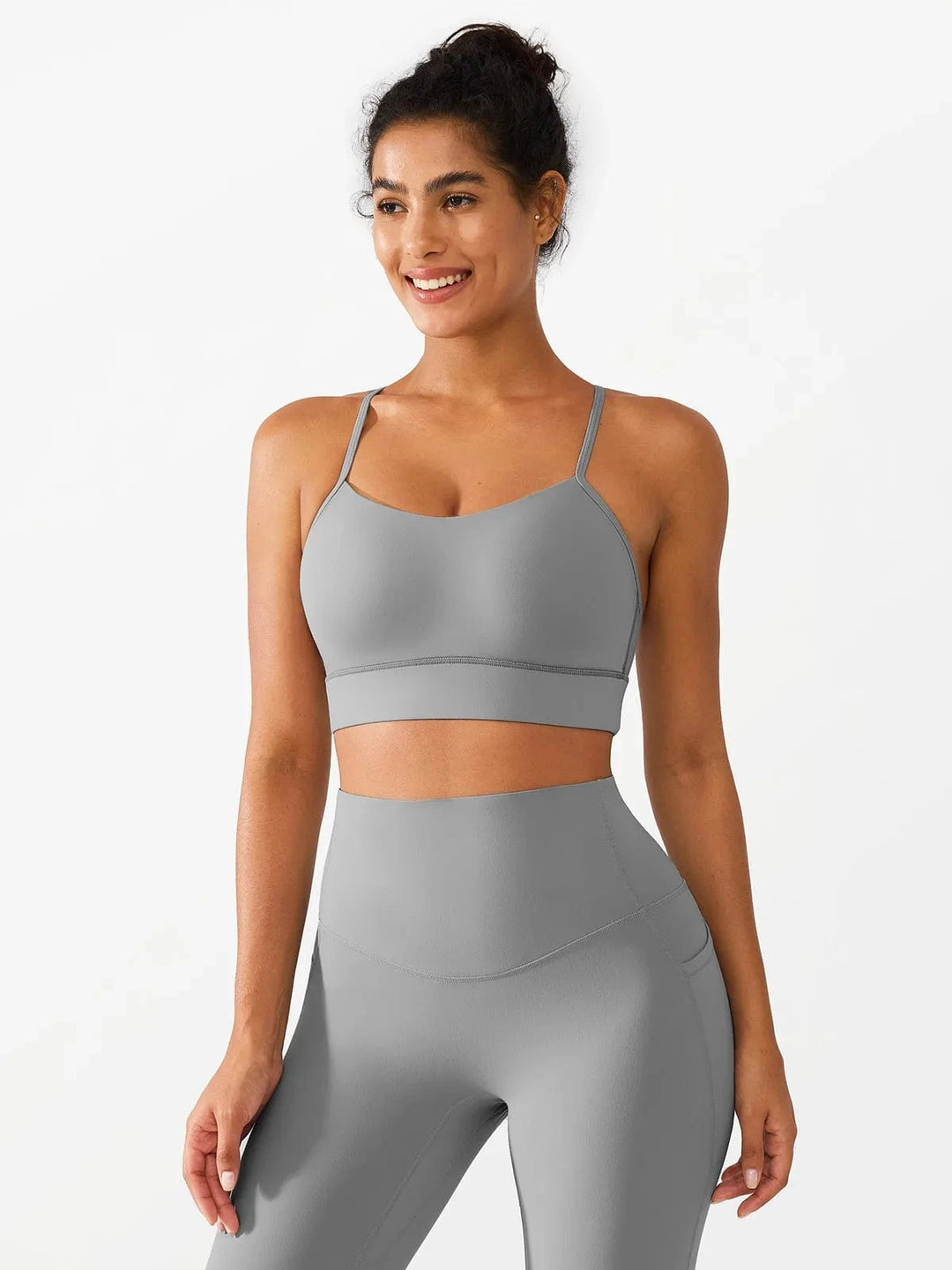 A model wearing a BRXL® Flow Y Racerback Bra with Low Cut and Spaghetti Straps in Gray / XS