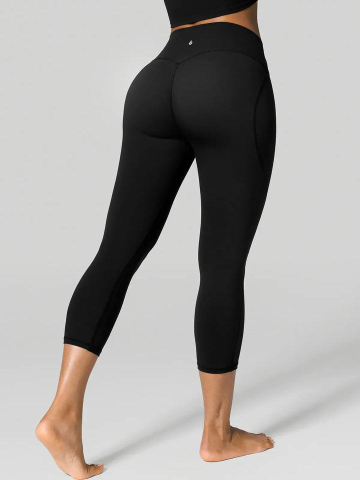 A model wearing a BRXL® Half Front Zipper Cropped Top Side Pockets Fleece Lined Leggings Set in