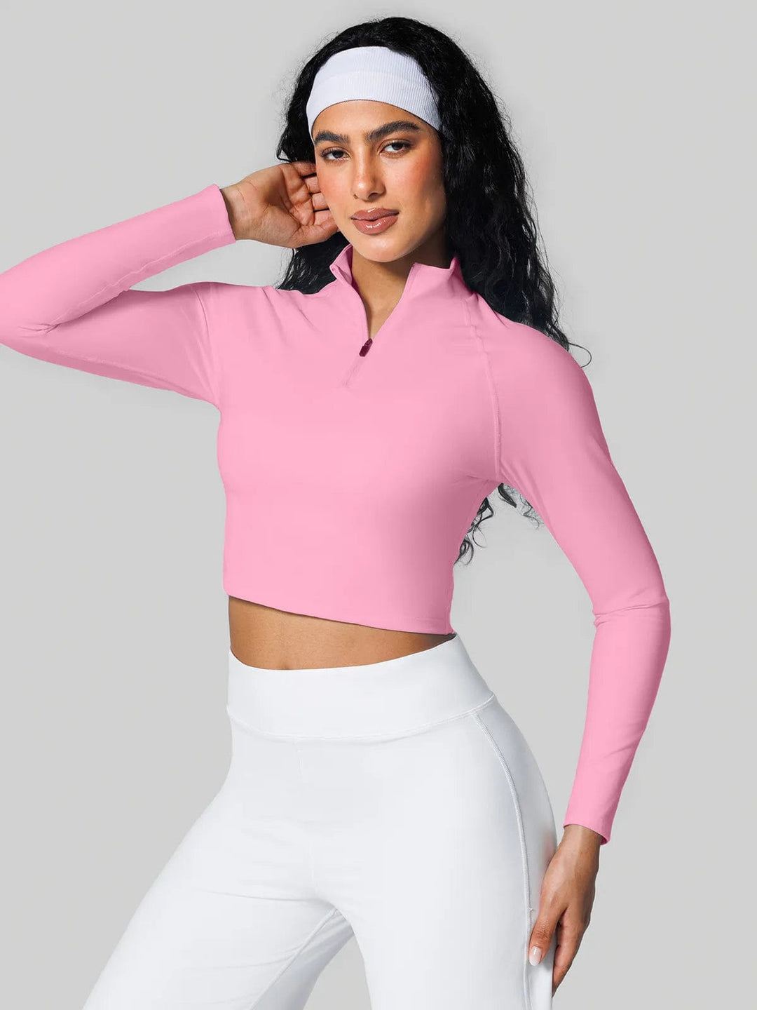 A model wearing a BRXL® Half Front Zipper Cropped Top Side Pockets Fleece Lined Leggings Set in Top / Pink / XS
