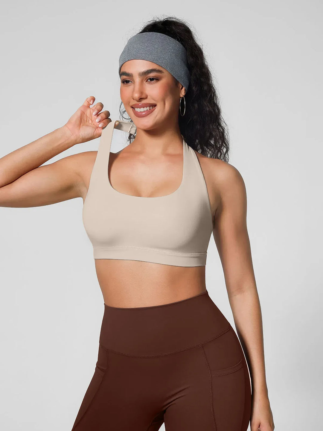 A model wearing a BRXL® Halter-neck Yoga Bra in