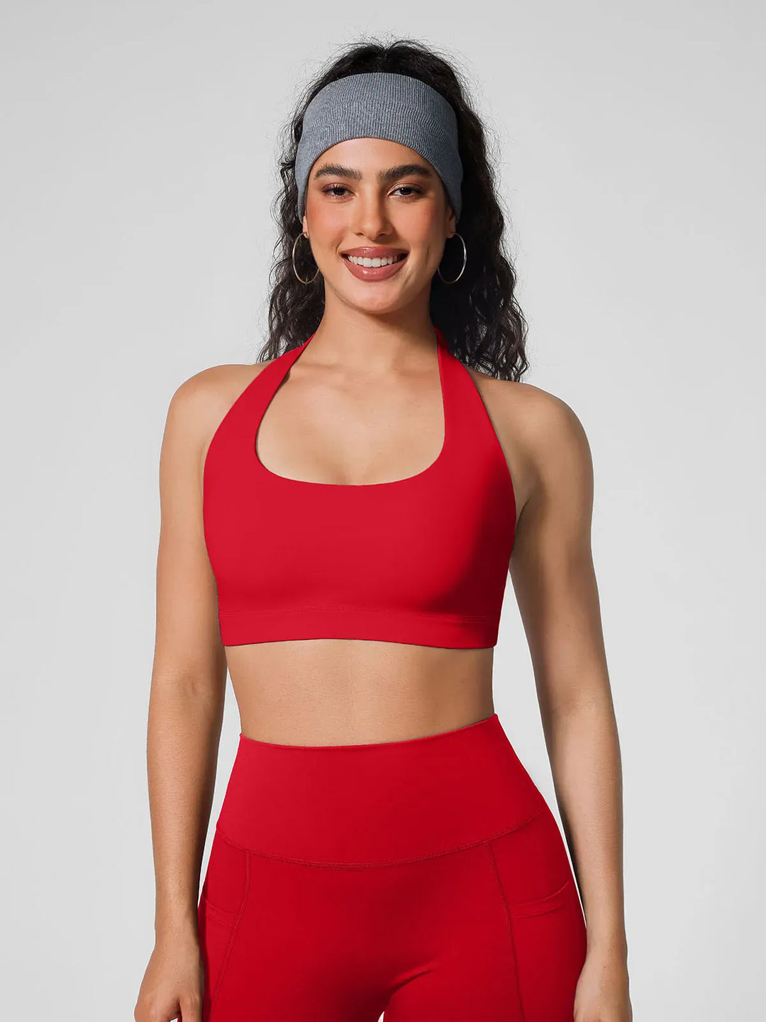 A model wearing a BRXL® Halter-neck Yoga Bra in
