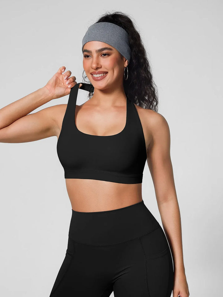 A model wearing a BRXL® Halter-neck Yoga Bra in
