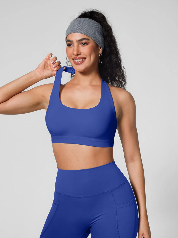 A model wearing a BRXL® Halter-neck Yoga Bra in
