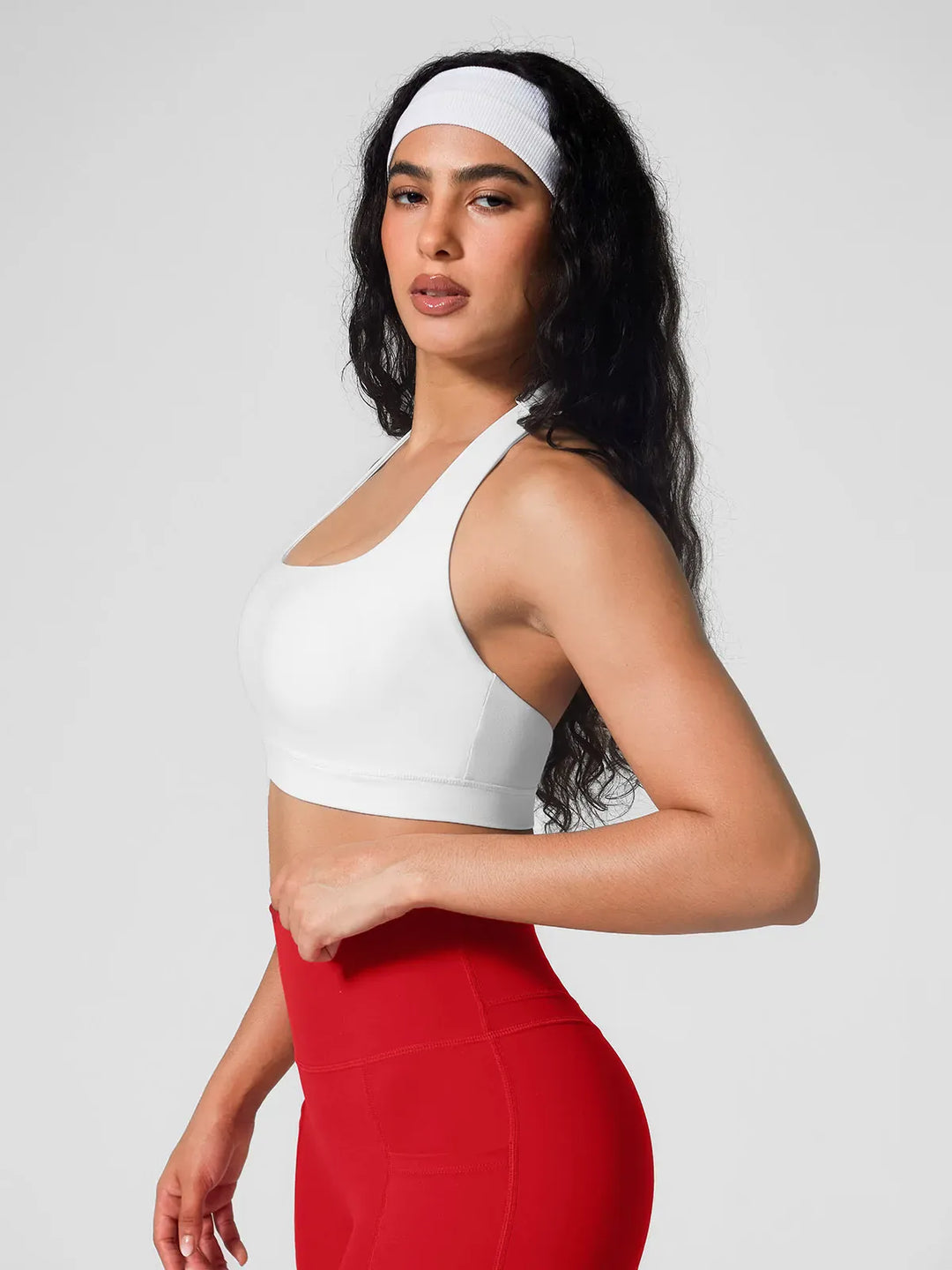 A model wearing a BRXL® Halter-neck Yoga Bra in