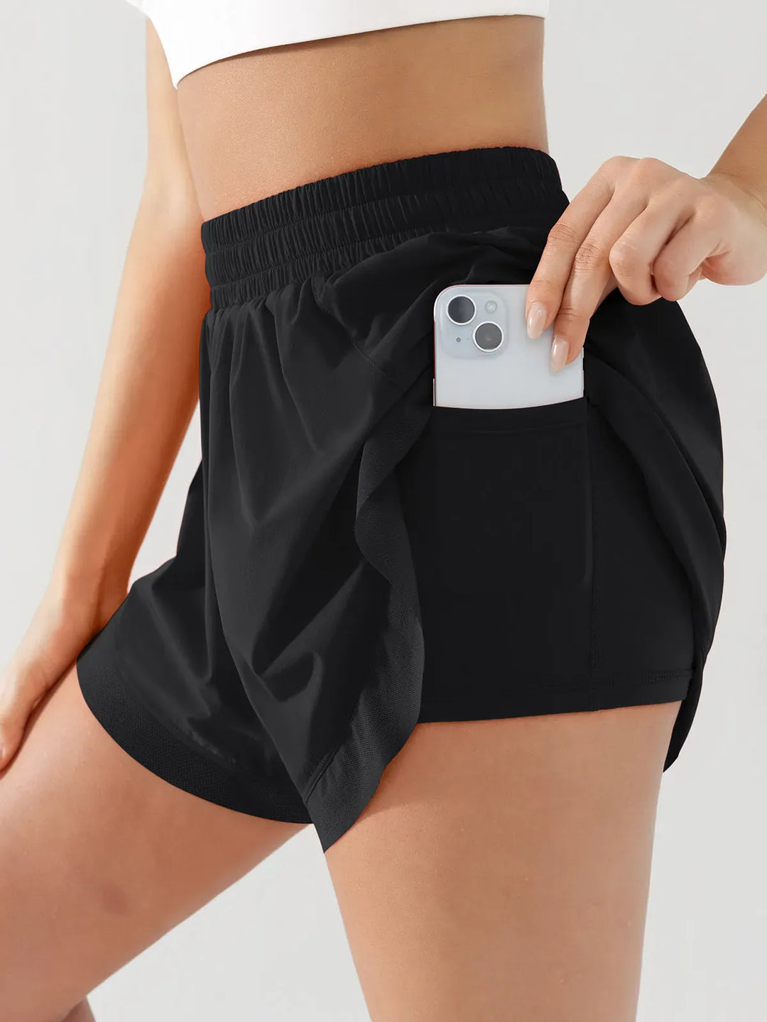 A model wearing a BRXL® High Waisted Butterfly Split Running Shorts in Black / S