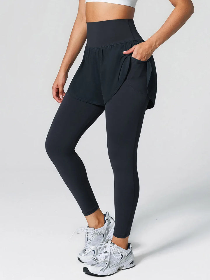 A model wearing a BRXL® Layered Combo Short Leggings in