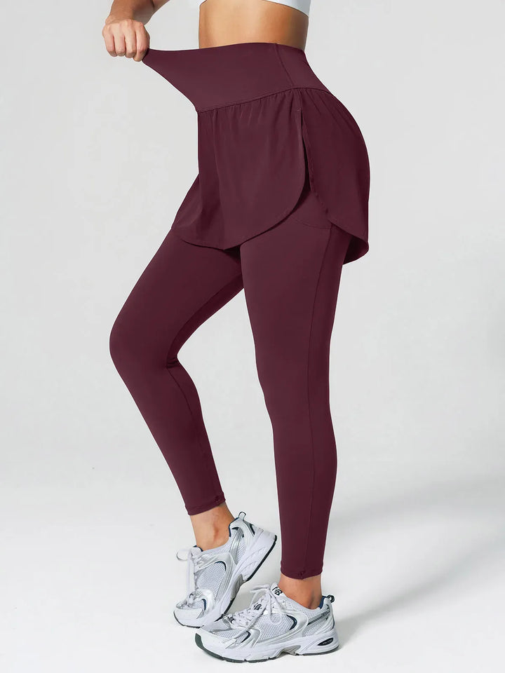 A model wearing a BRXL® Layered Combo Short Leggings in