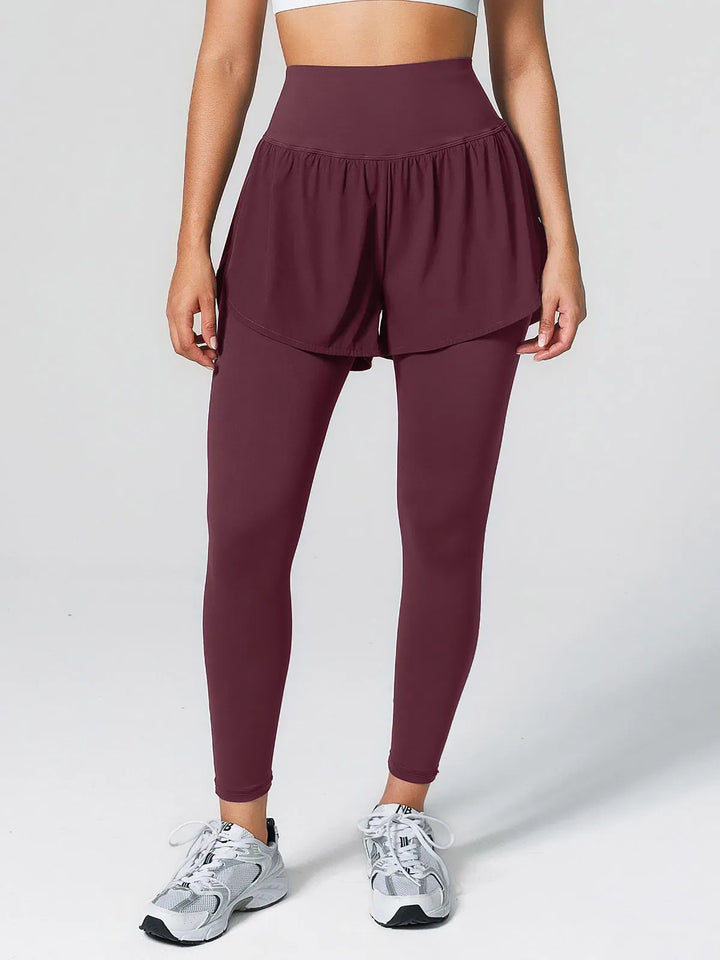 A model wearing a BRXL® Layered Combo Short Leggings in Red / XS