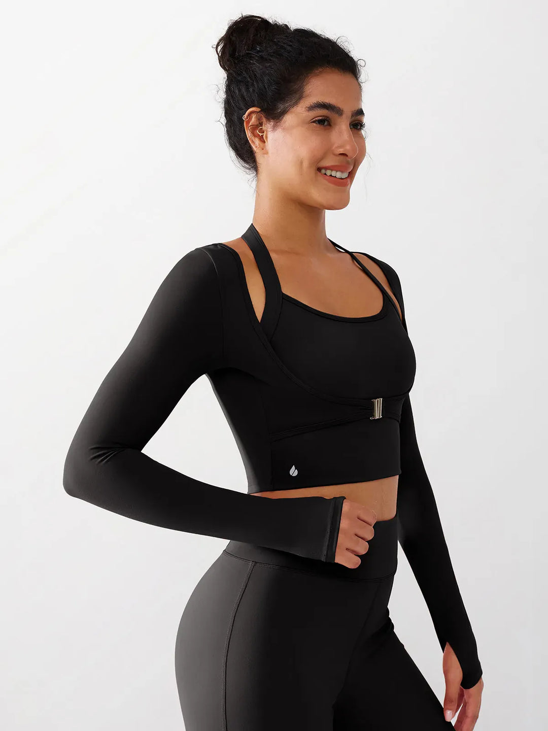 A model wearing a BRXL® Long Sleeve Halter Shrug Top with Buckle and Thumbhole in