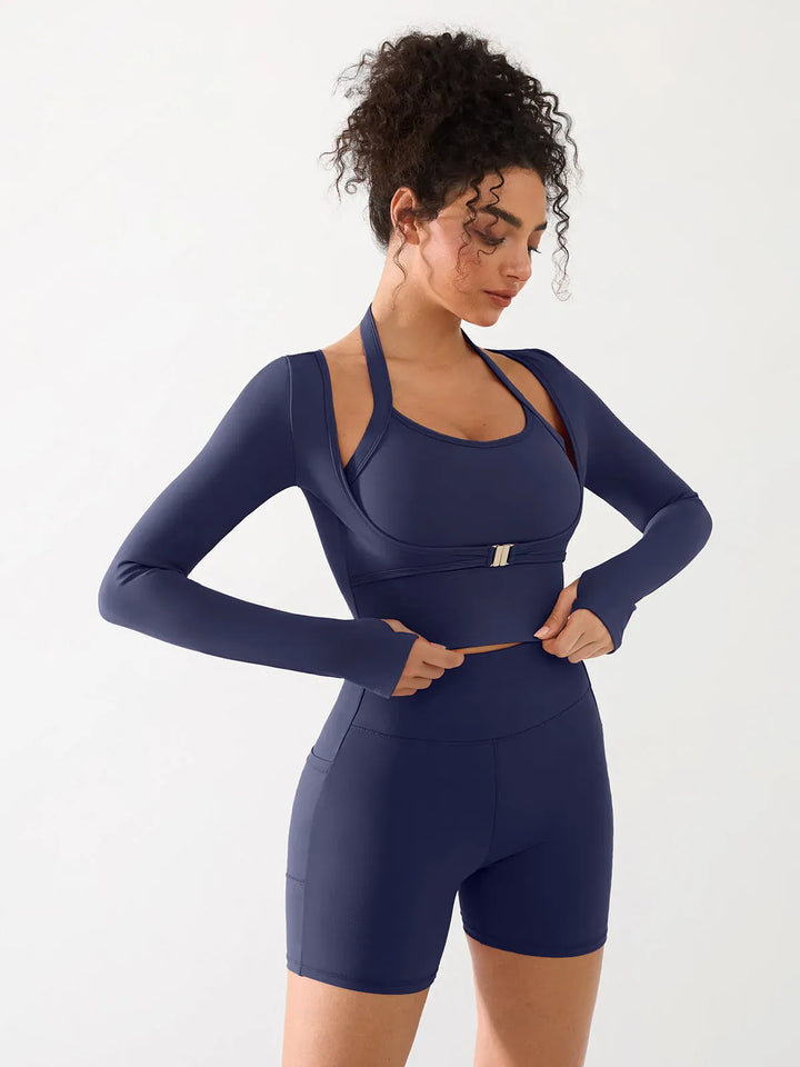 A model wearing a BRXL® Long Sleeve Halter Shrug Top with Buckle and Thumbhole in