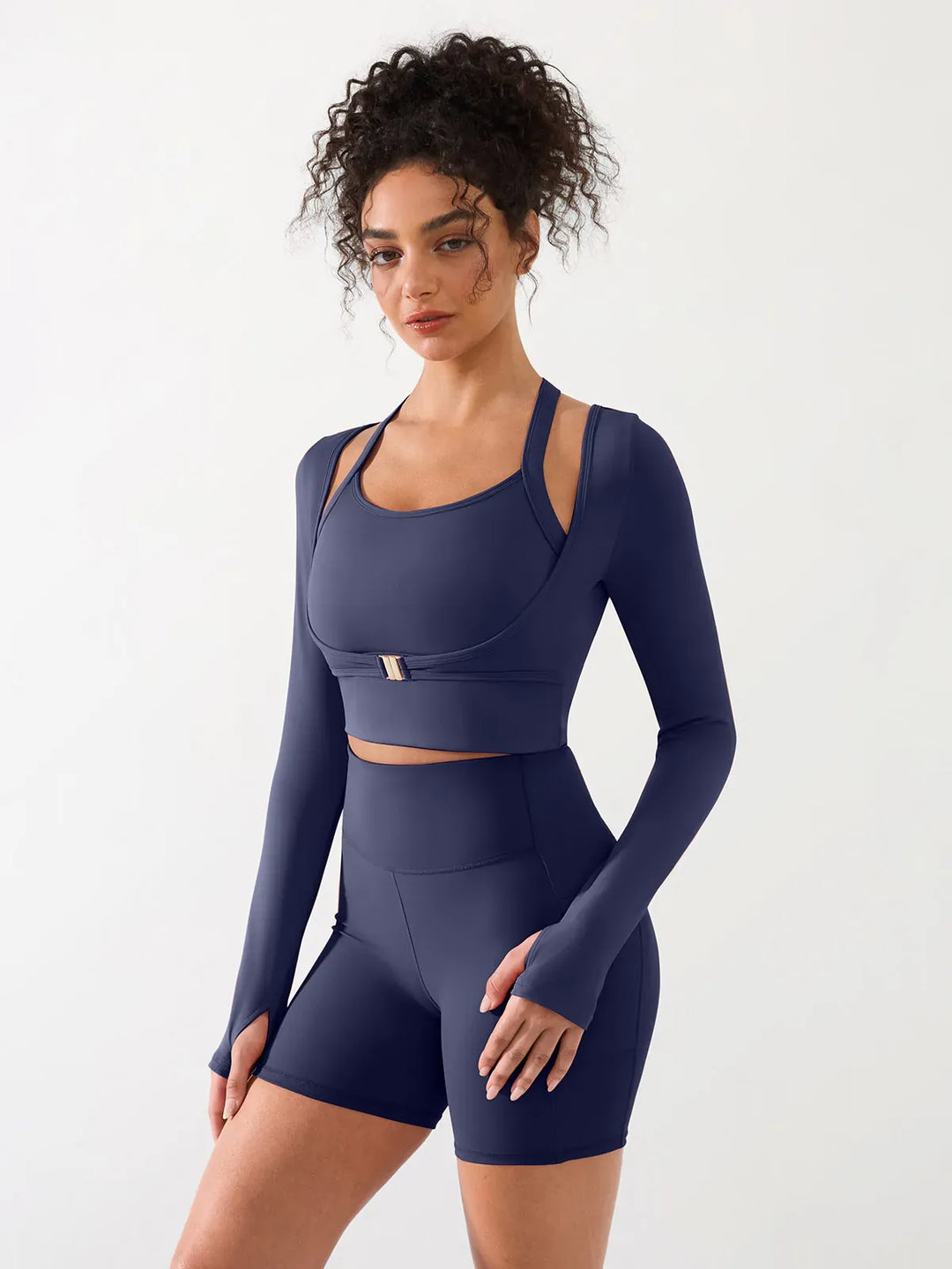 A model wearing a BRXL® Long Sleeve Halter Shrug Top with Buckle and Thumbhole in