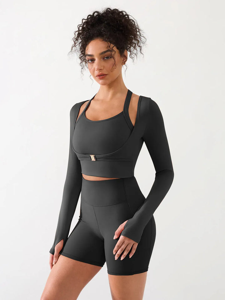 A model wearing a BRXL® Long Sleeve Halter Shrug Top with Buckle and Thumbhole in