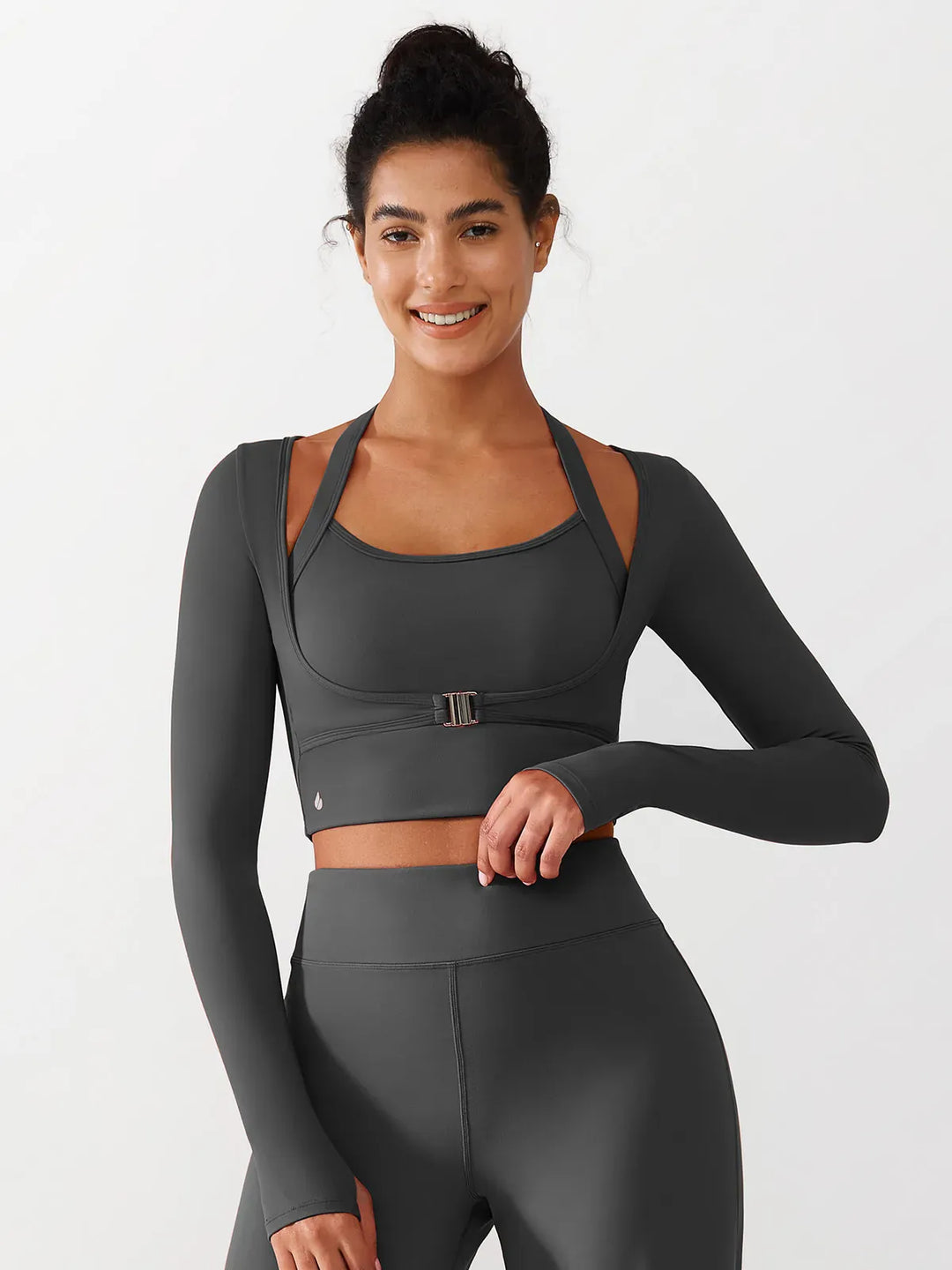 A model wearing a BRXL® Long Sleeve Halter Shrug Top with Buckle and Thumbhole in