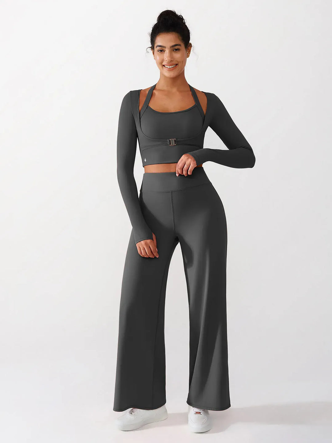 A model wearing a BRXL® Long Sleeve Halter Shrug Top with Buckle and Thumbhole in