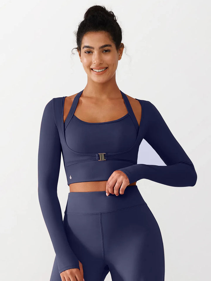 A model wearing a BRXL® Long Sleeve Halter Shrug Top with Buckle and Thumbhole in Blue / XS