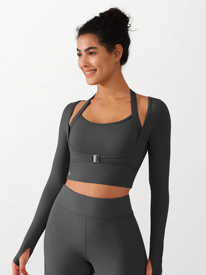 A model wearing a BRXL® Long Sleeve Halter Shrug Top with Buckle and Thumbhole in Gray / XS