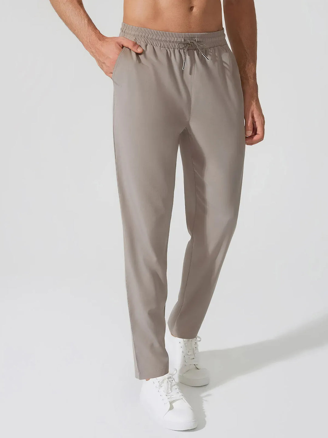 A model wearing a BRXL® Men’s  Adjustable Waist Tapered Activewear Joggers in