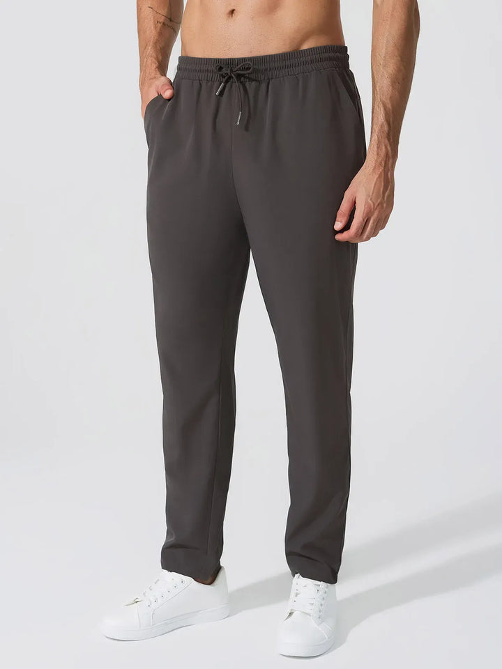 A model wearing a BRXL® Men’s  Adjustable Waist Tapered Activewear Joggers in