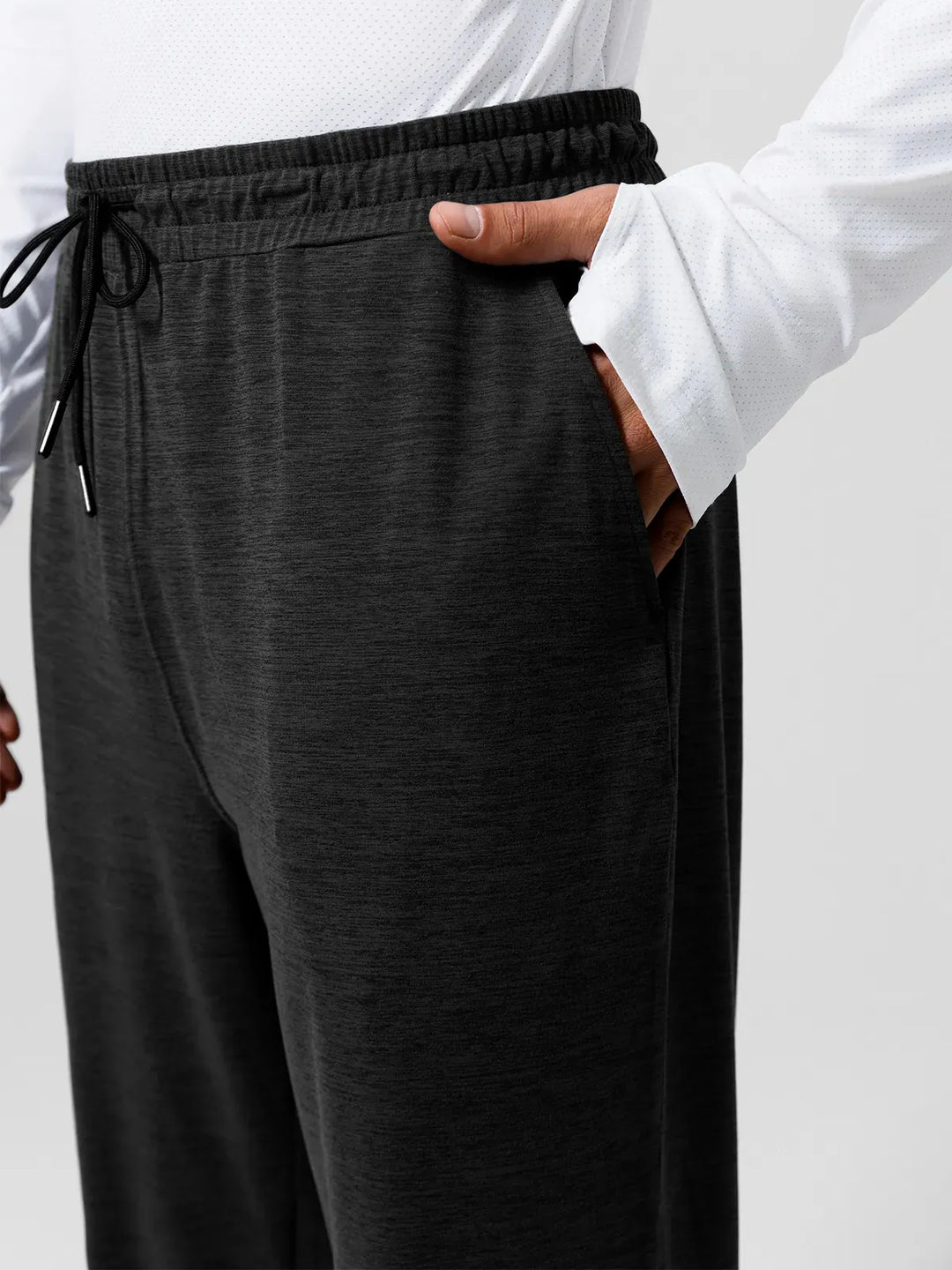 A model wearing a BRXL® Men’s Smooth Four Pockets Tapered Joggers in