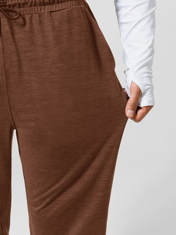 A model wearing a BRXL® Men’s Smooth Four Pockets Tapered Joggers in