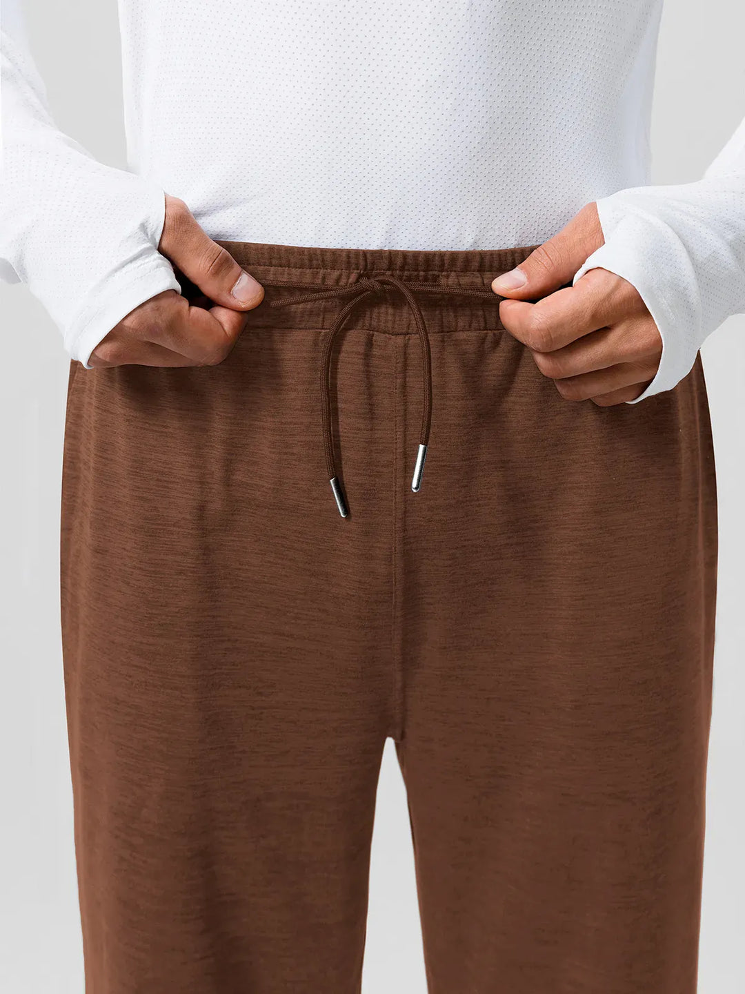 A model wearing a BRXL® Men’s Smooth Four Pockets Tapered Joggers in