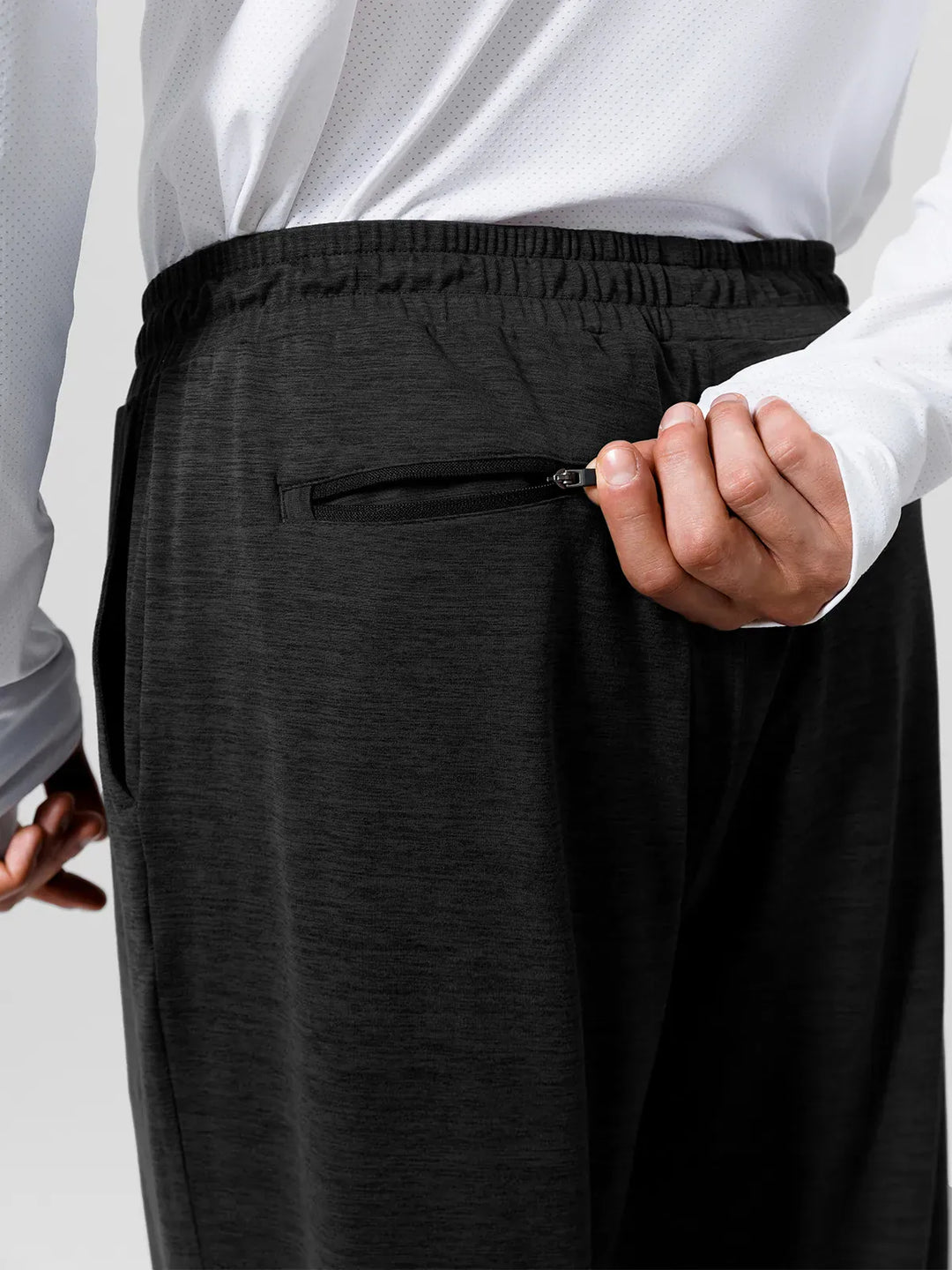 A model wearing a BRXL® Men’s Smooth Four Pockets Tapered Joggers in