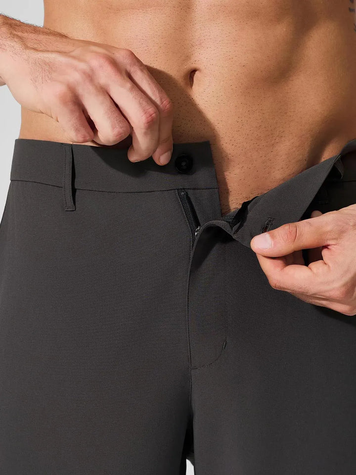 A model wearing a BRXL® Men’s Straight Leg Golf Pants in