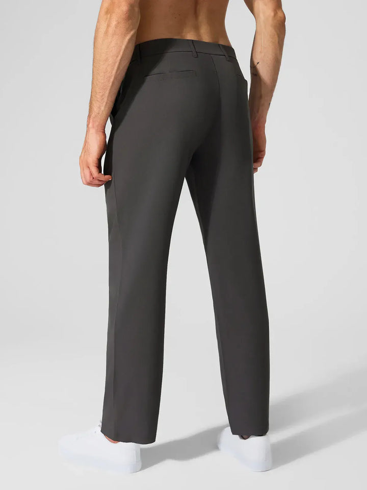 A model wearing a BRXL® Men’s Straight Leg Golf Pants in