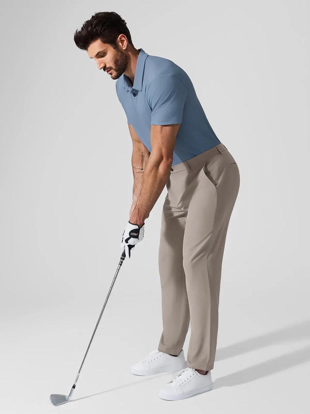 A model wearing a BRXL® Men’s Straight Leg Golf Pants in