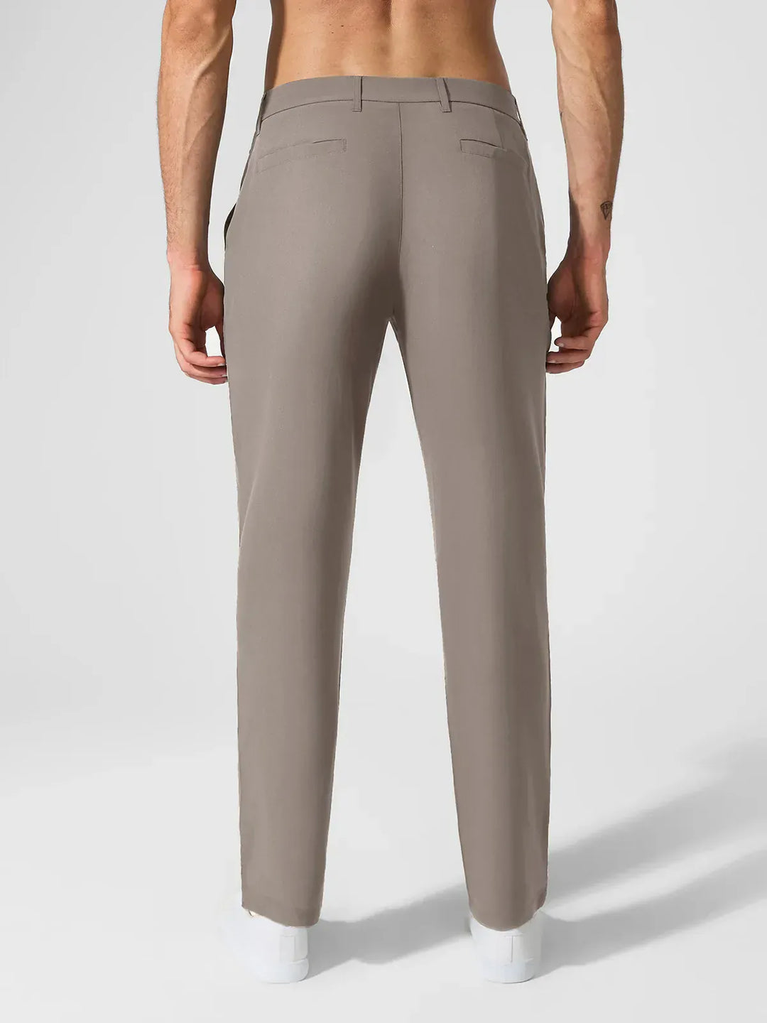 A model wearing a BRXL® Men’s Straight Leg Golf Pants in