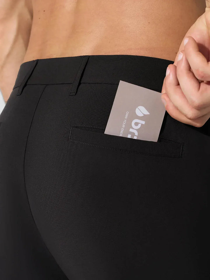 A model wearing a BRXL® Men’s Straight Leg Golf Pants in