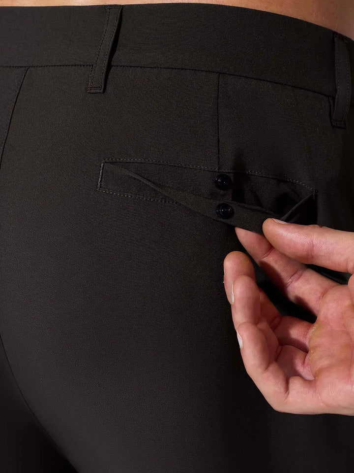 A model wearing a BRXL® Men’s Straight Leg Golf Pants in