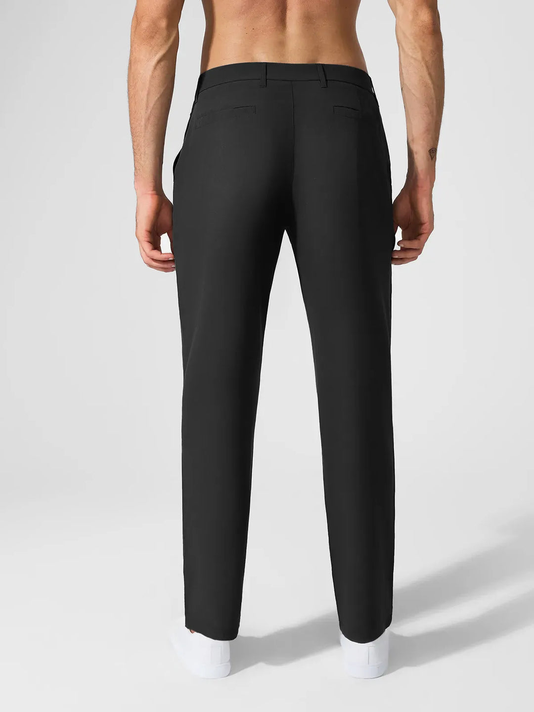 A model wearing a BRXL® Men’s Straight Leg Golf Pants in