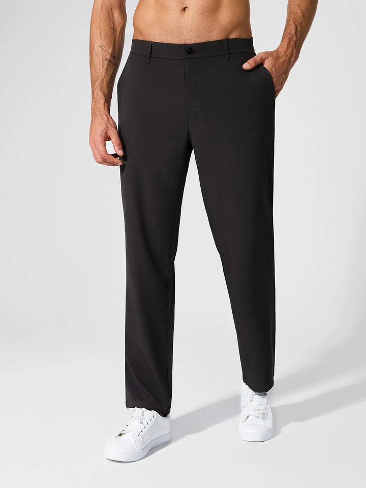 A model wearing a BRXL® Men’s Straight Leg Golf Pants in Black / S