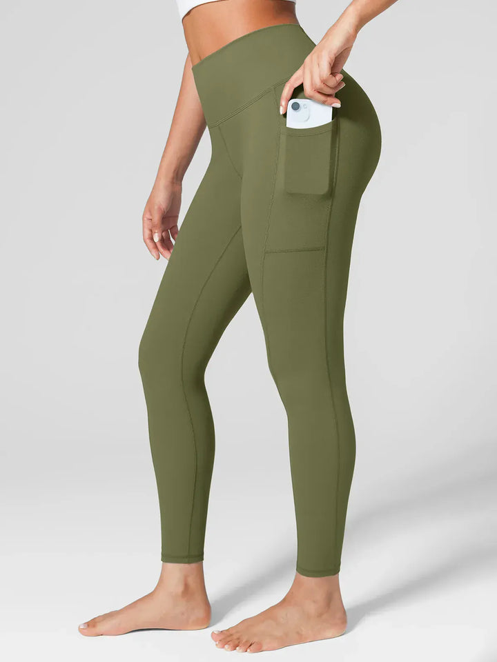 A model wearing a BRXL® One Size Fits Most Sporty High-Waisted Leggings in Green / S (S/M/L)