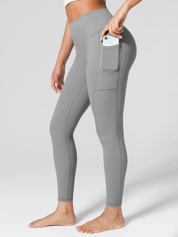 A model wearing a BRXL® One Size Fits Most Sporty High-Waisted Leggings in Grey / S (S/M/L)