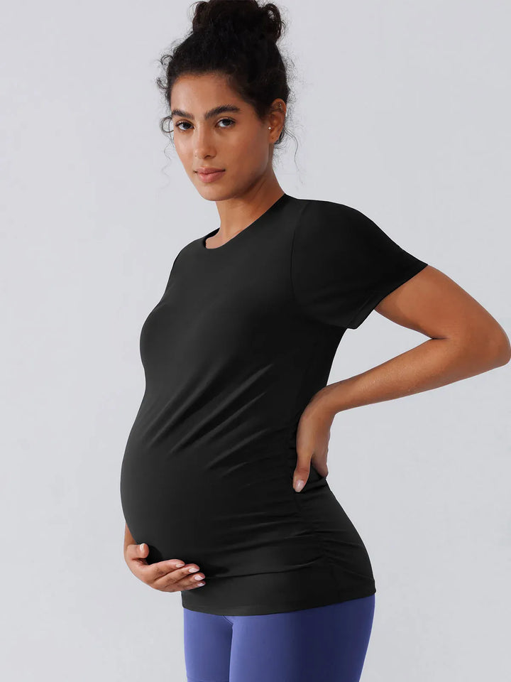 A model wearing a BRXL® Ruched Maternity T Shirts with Shelf Bra in S(4-6) / Black