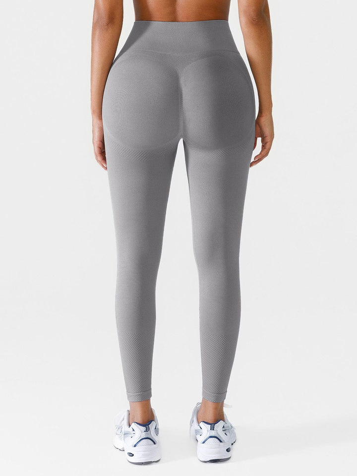 A model wearing a BRXL® Seamless Butt Scrunch Spandx Leggings With Tummy Control in