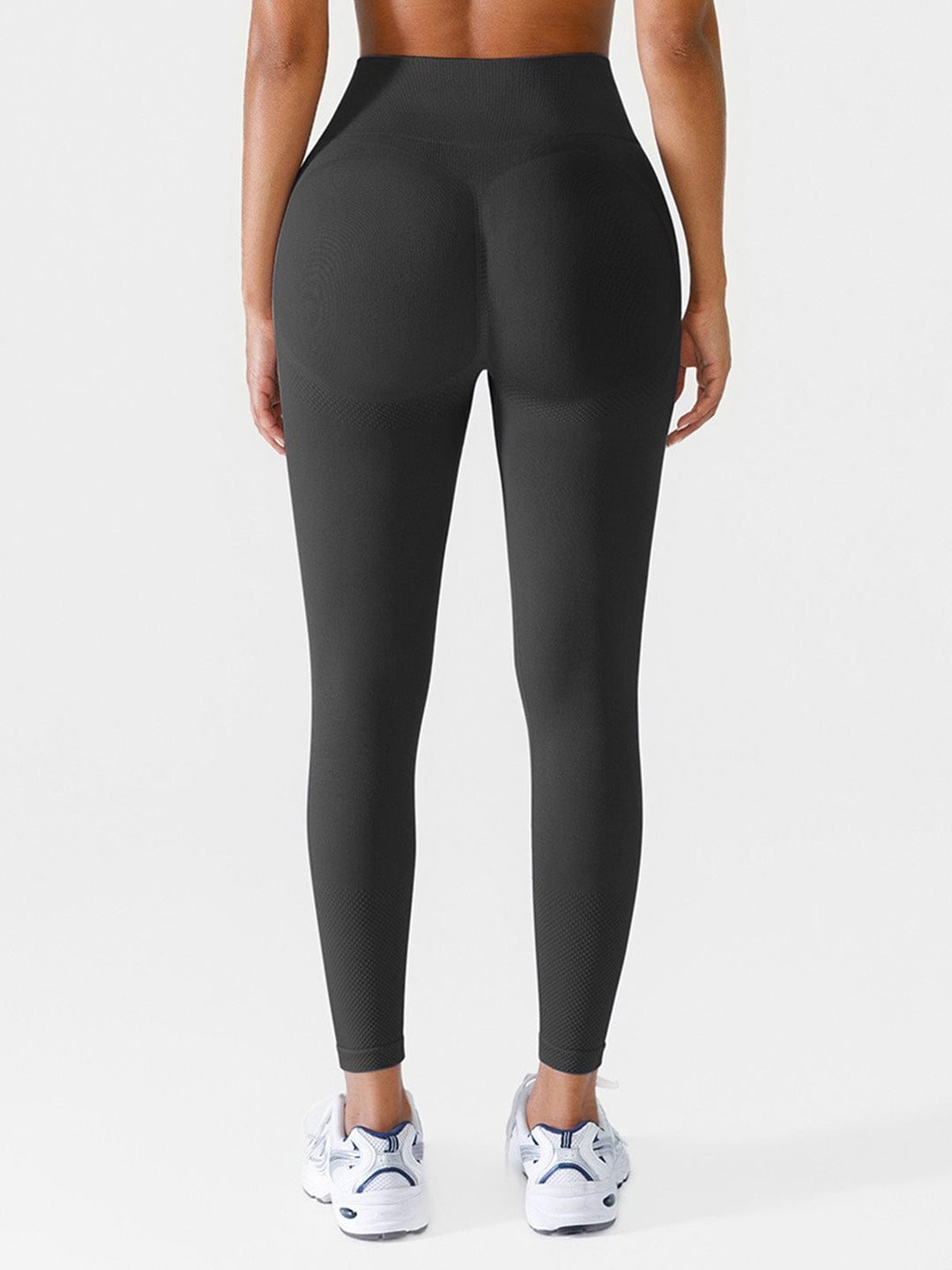 A model wearing a BRXL® Seamless Butt Scrunch Spandx Leggings With Tummy Control in