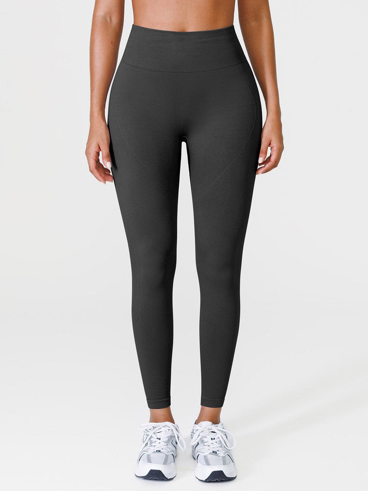 A model wearing a BRXL® Seamless Butt Scrunch Spandx Leggings With Tummy Control in