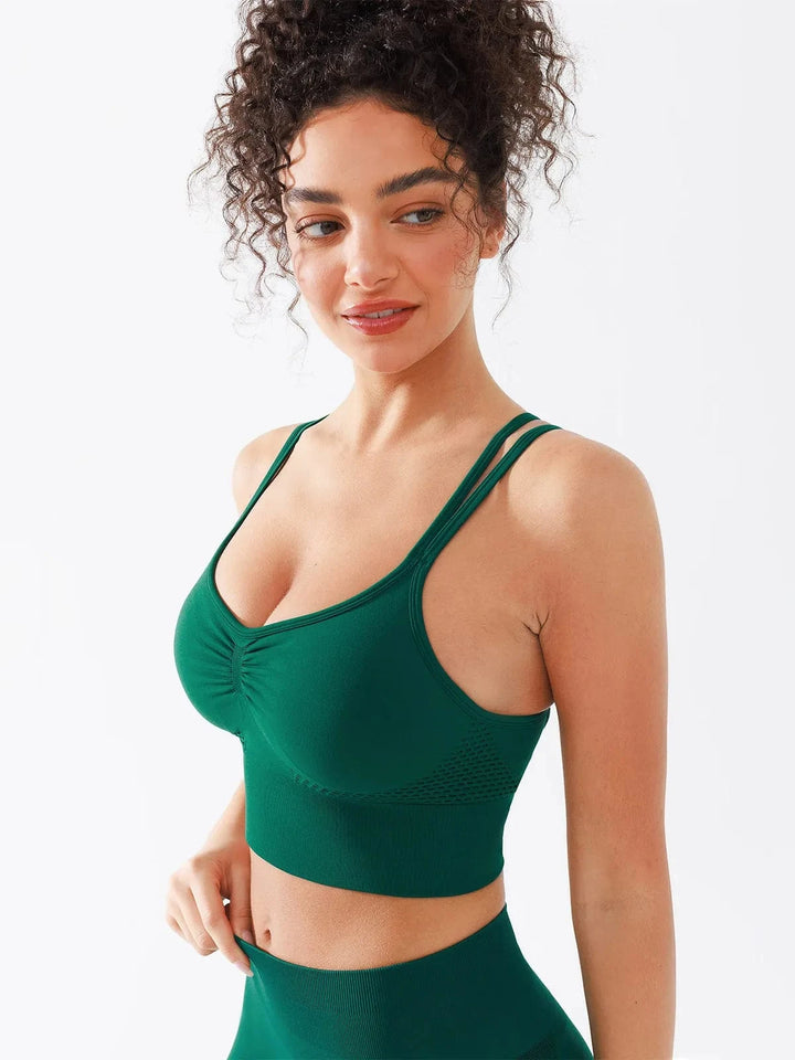 A model wearing a BRXL® Seamless Criss Cross Spaghetti Racerback Sports Bra in