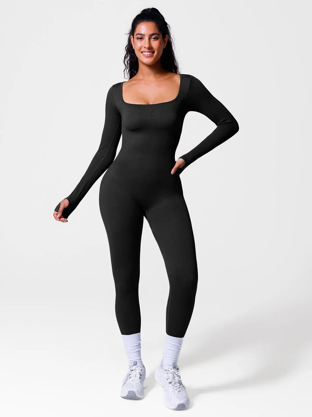A model wearing a BRXL® Seamless Square Neck Tummy Control Jumpsuits in Long Sleeve / Black / XS