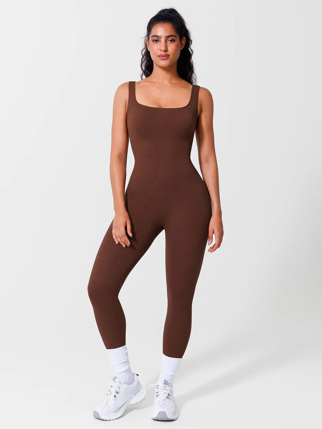 A model wearing a BRXL® Seamless Square Neck Tummy Control Jumpsuits in Tank / Brown / S
