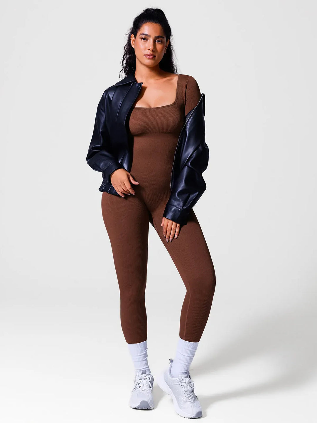 A model wearing a BRXL® Yoga Activewear Jumpsuit Winter Shapewear Long Sleeve Thumb Hole Jumpsuit in