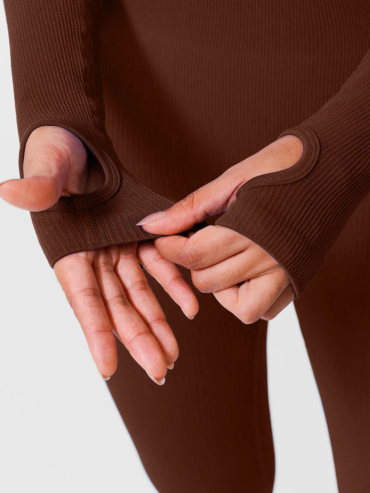 A model wearing a BRXL® Yoga Activewear Jumpsuit Winter Shapewear Long Sleeve Thumb Hole Jumpsuit in