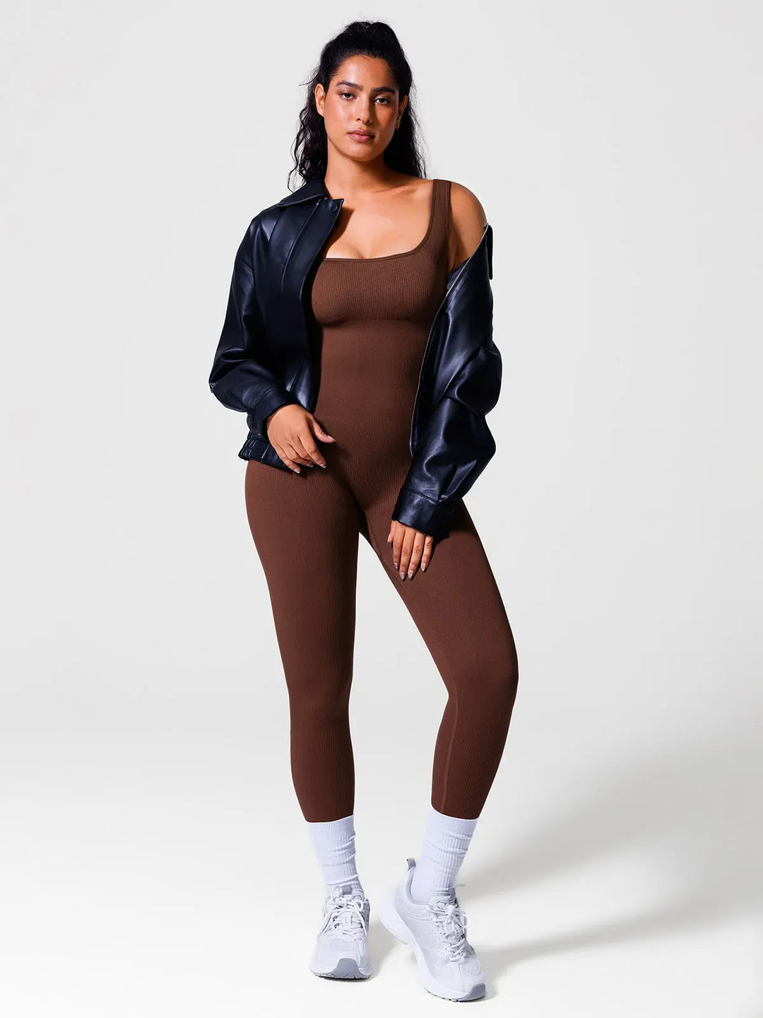 A model wearing a BRXL® Yoga Activewear Jumpsuit Shapewear Seamless Square Neck Tank Workout Jumpsuit in