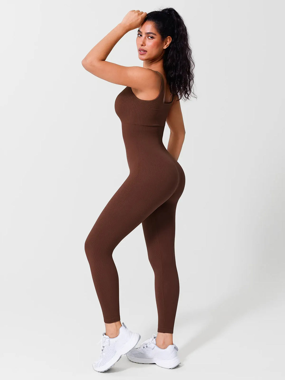 A model wearing a BRXL® Yoga Activewear Jumpsuit Shapewear Seamless Square Neck Tank Workout Jumpsuit in