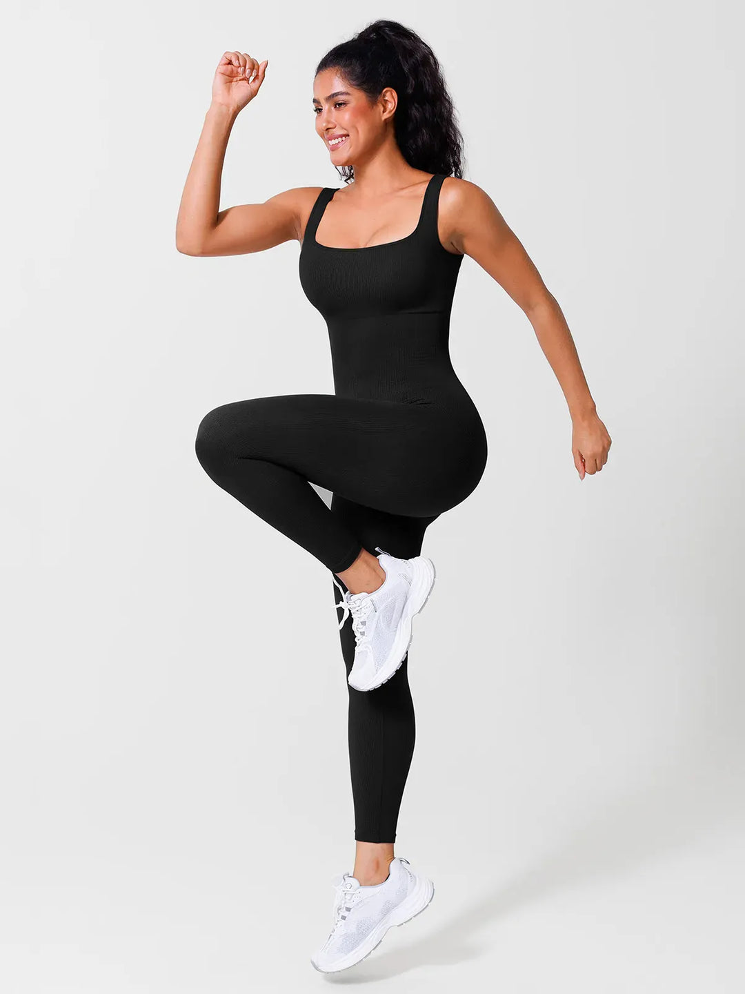 A model wearing a BRXL® Yoga Activewear Jumpsuit Shapewear Seamless Square Neck Tank Workout Jumpsuit in